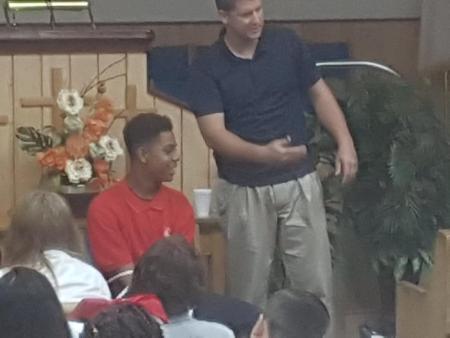 Student participating in Chapel